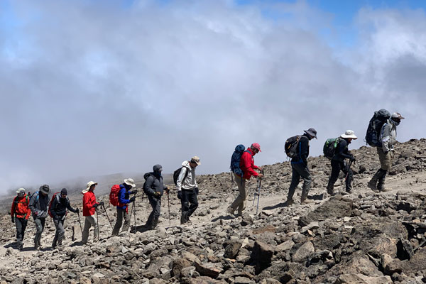 Trekkers ascend the Machame route while climbing Kilimanjaro
